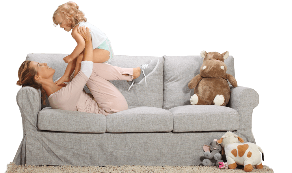 Woman playing with toddler on a couch