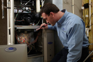 Contractor inspecting HVAC System