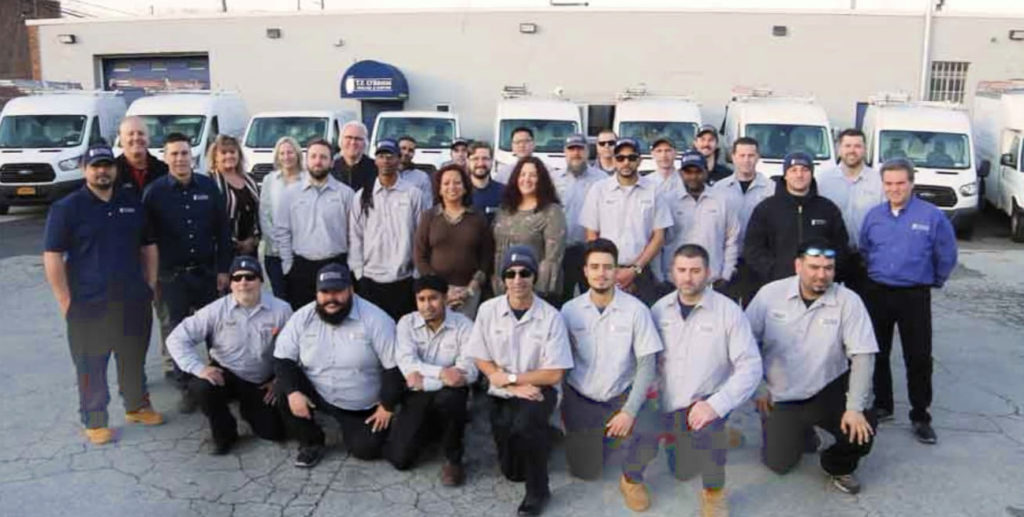 group shot of the TF O'brien team posing in rows