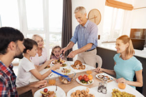 multigenerational family enjoys holiday meal