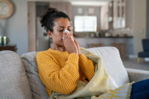 woman sneezing as a result of fall allergies