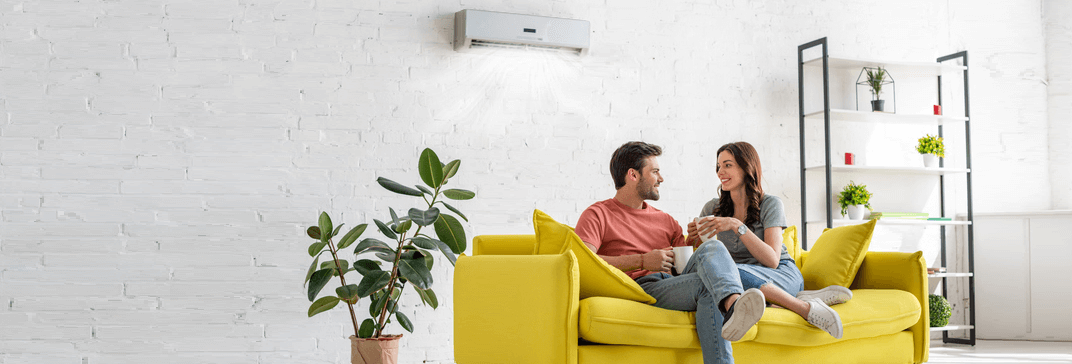 people on a couch with a ductless system