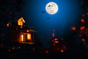 spooky house with bats and full moon