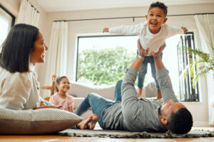 happy family plays together in home