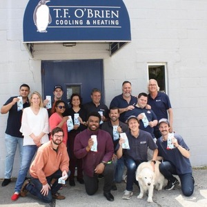 Photo of T.F. O'Brien team holding socks.