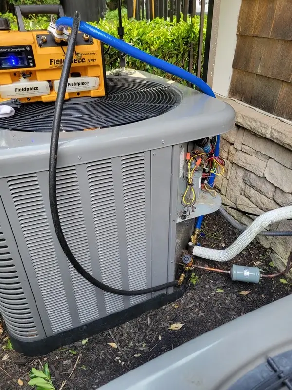 An outdoor AC unit during service work.