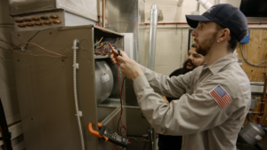 technician works on furnace