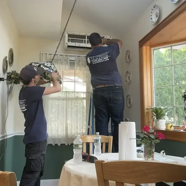 Installing a mini split ductless system in a sun room.