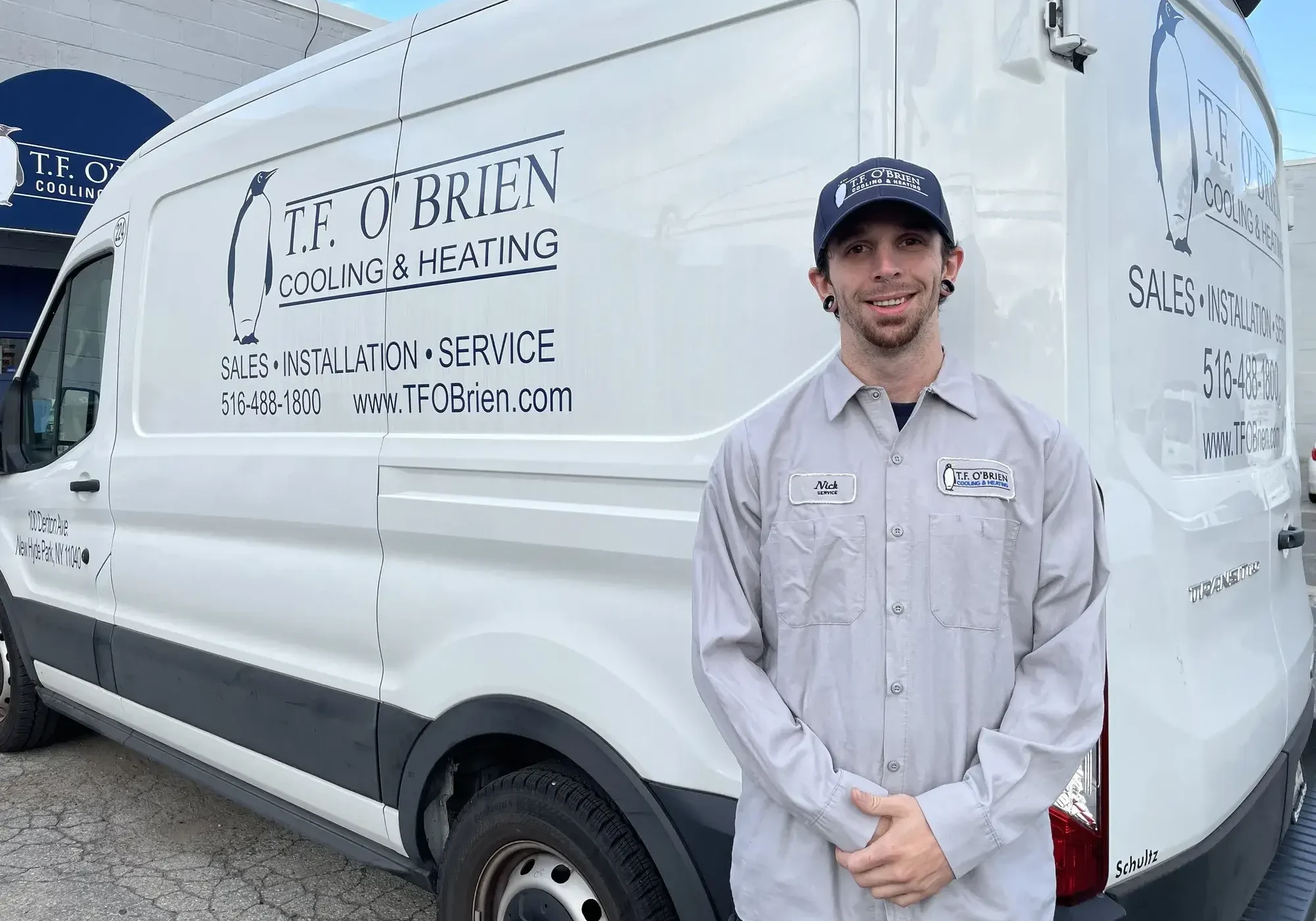 hvac technician in front of truck