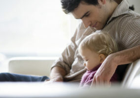 man relaxing with child